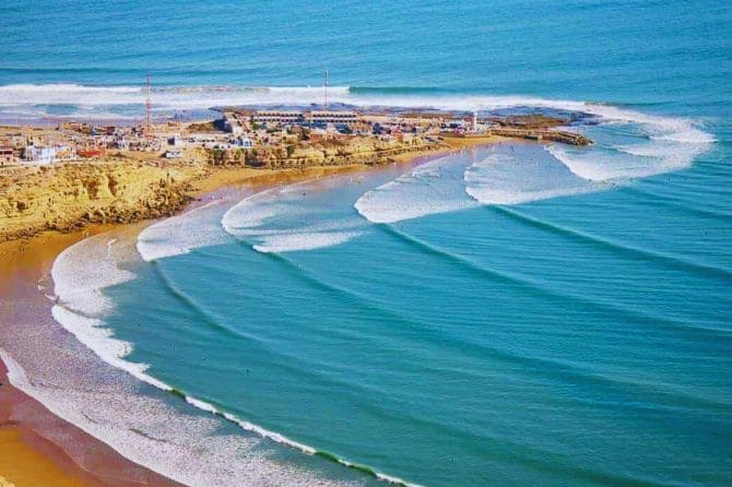 Golden sands of Essaouira beach with waves